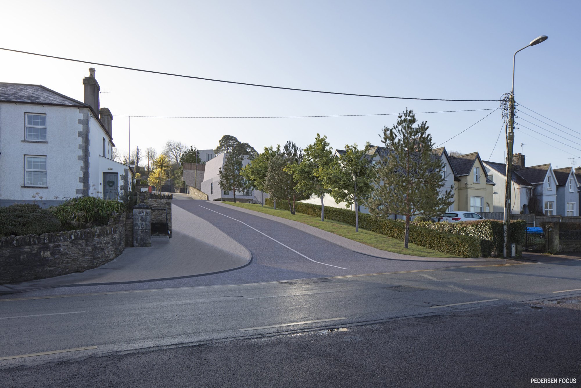 Photomontage of the proposed housing at Lower Road, Knocknagore, Crosshaven, set into a photograph of the existing village street.